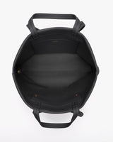 Open handbag with two handles and a pocket inside.