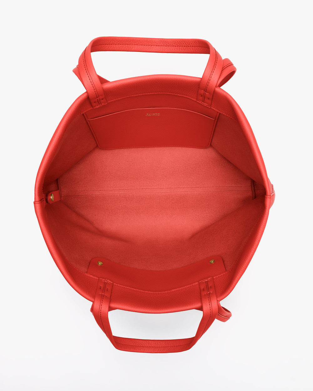Open top view of a handbag with handles and inner pocket.