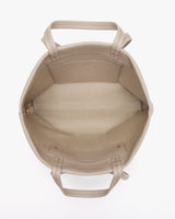 Open tote bag with interior pocket and handles.