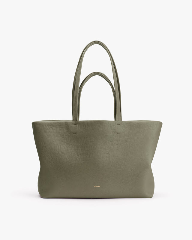 Large tote bag with long handles on white background.
