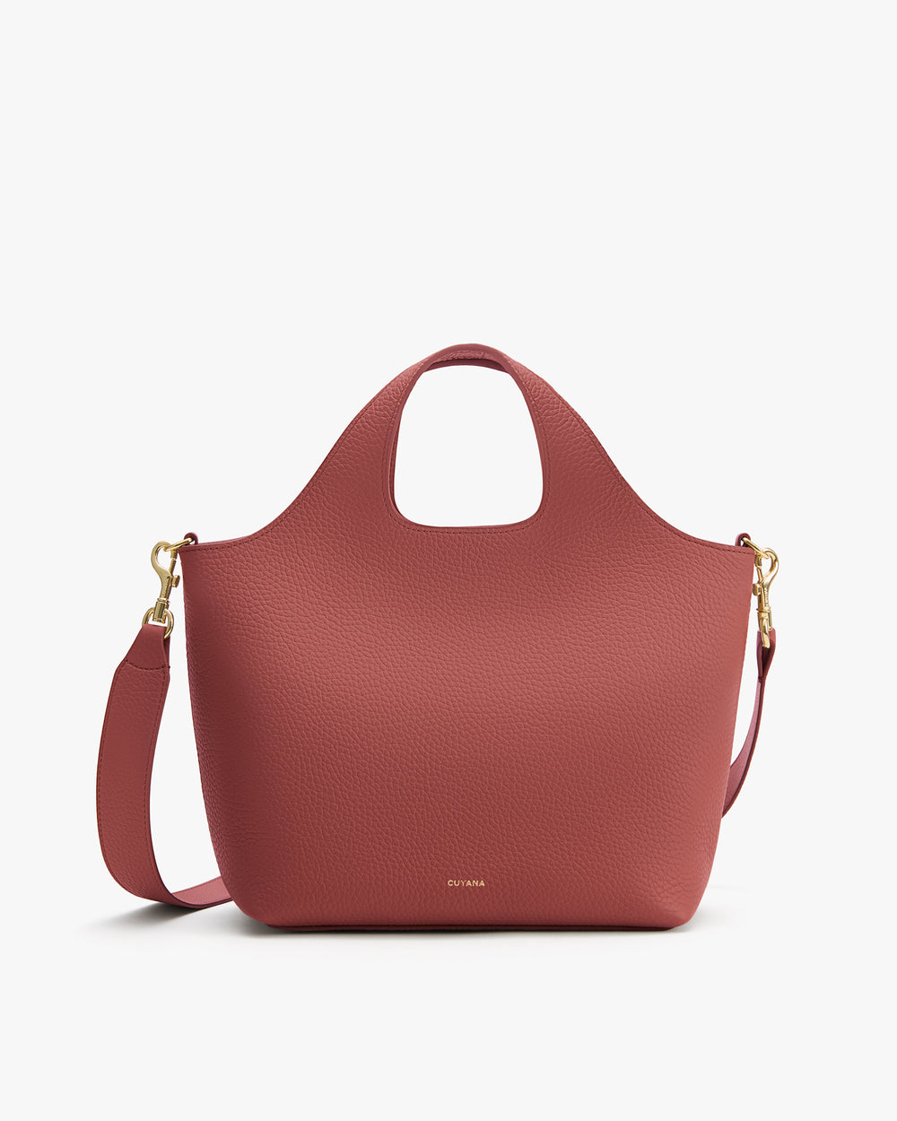 Handbag with curved top handles and removable shoulder strap.