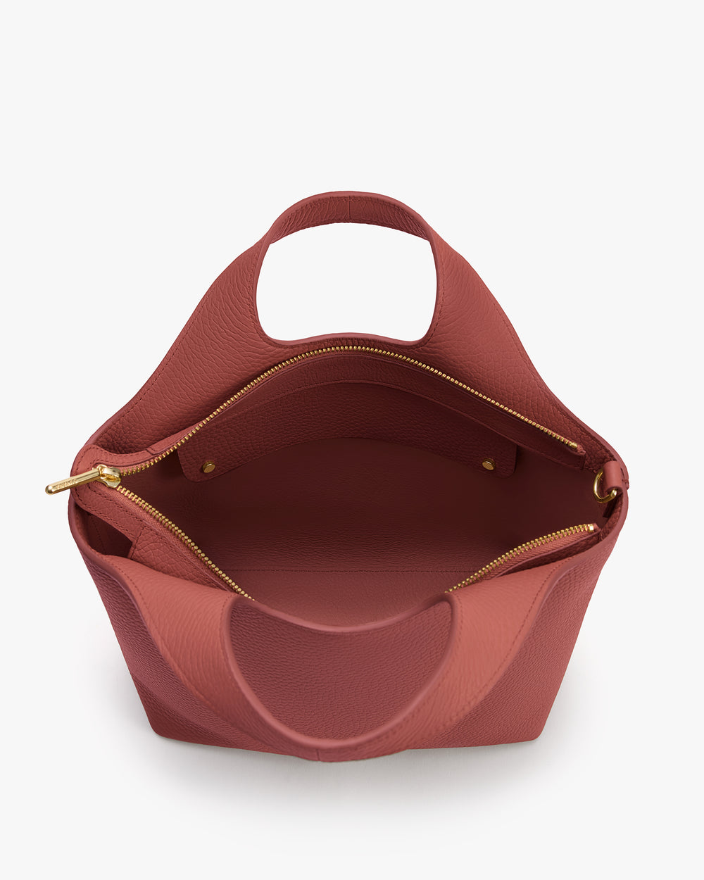 Handbag with open top and zipper pocket inside.