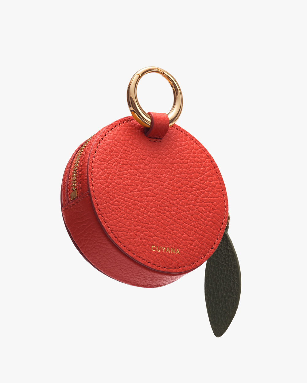 Round leather pouch with metal ring handle and zipper.