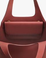 Open tote bag with inner pocket and short handles.