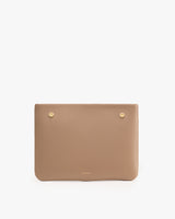 Rectangular textured clutch with button details.