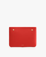Rectangular pouch with two small round metal studs at the top.