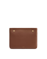 Rectangular leather clutch with two metal studs near the top.
