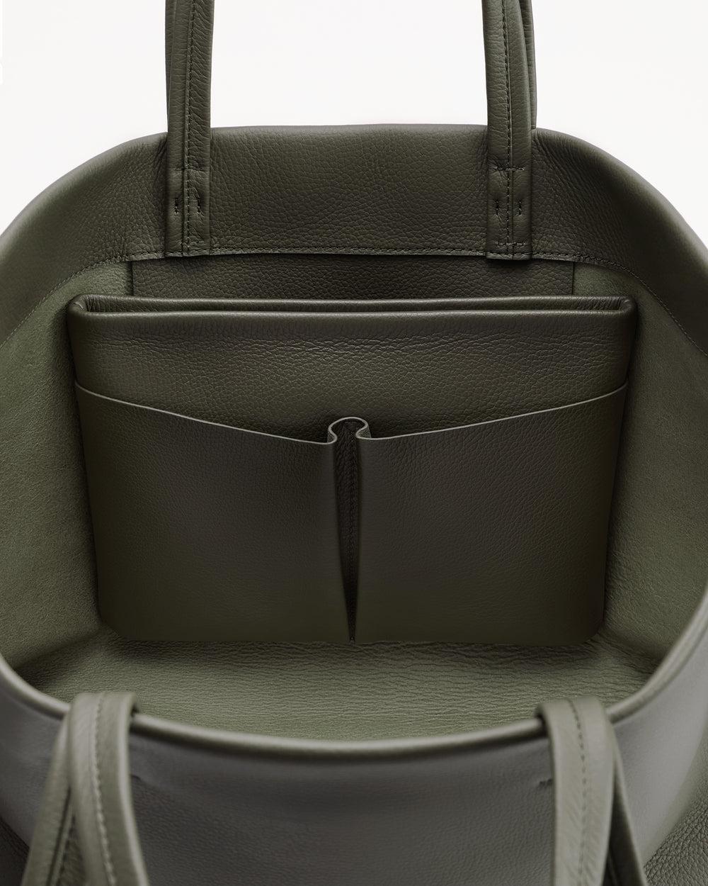 Open handbag with inner pocket and two handles visible.