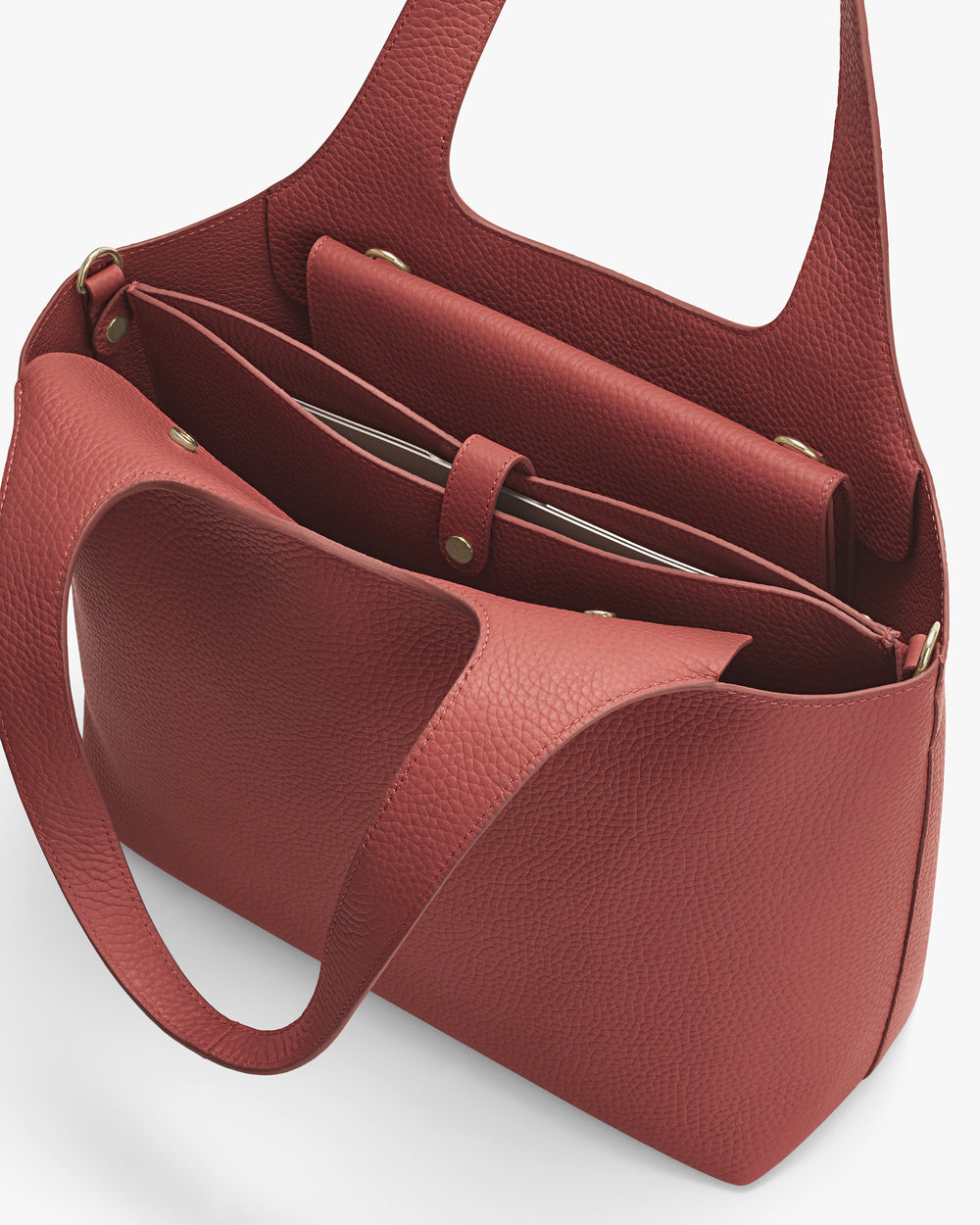 Open tote bag with multiple compartments and long handles.