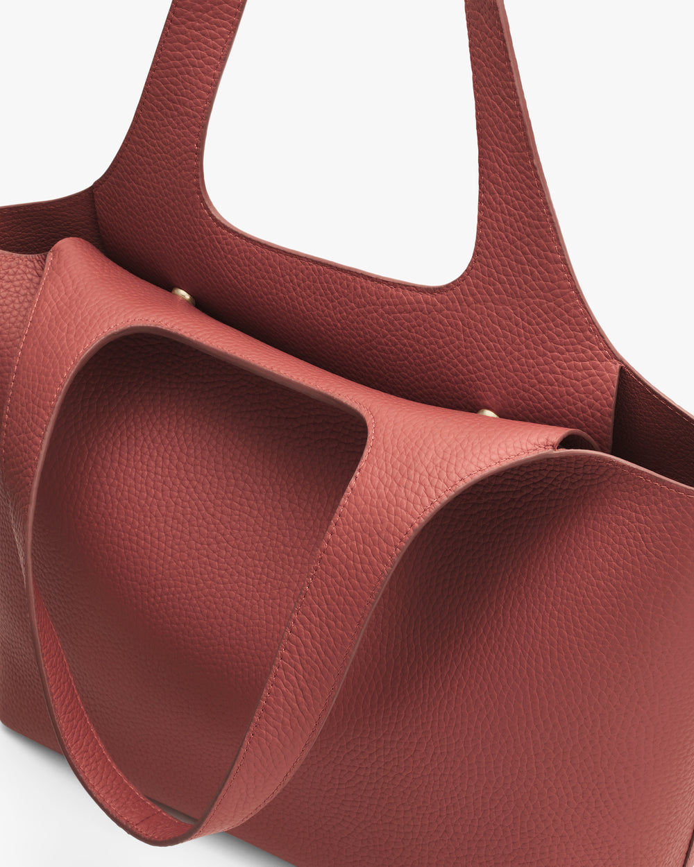 Leather tote bag with wide handles and a spacious interior pocket.