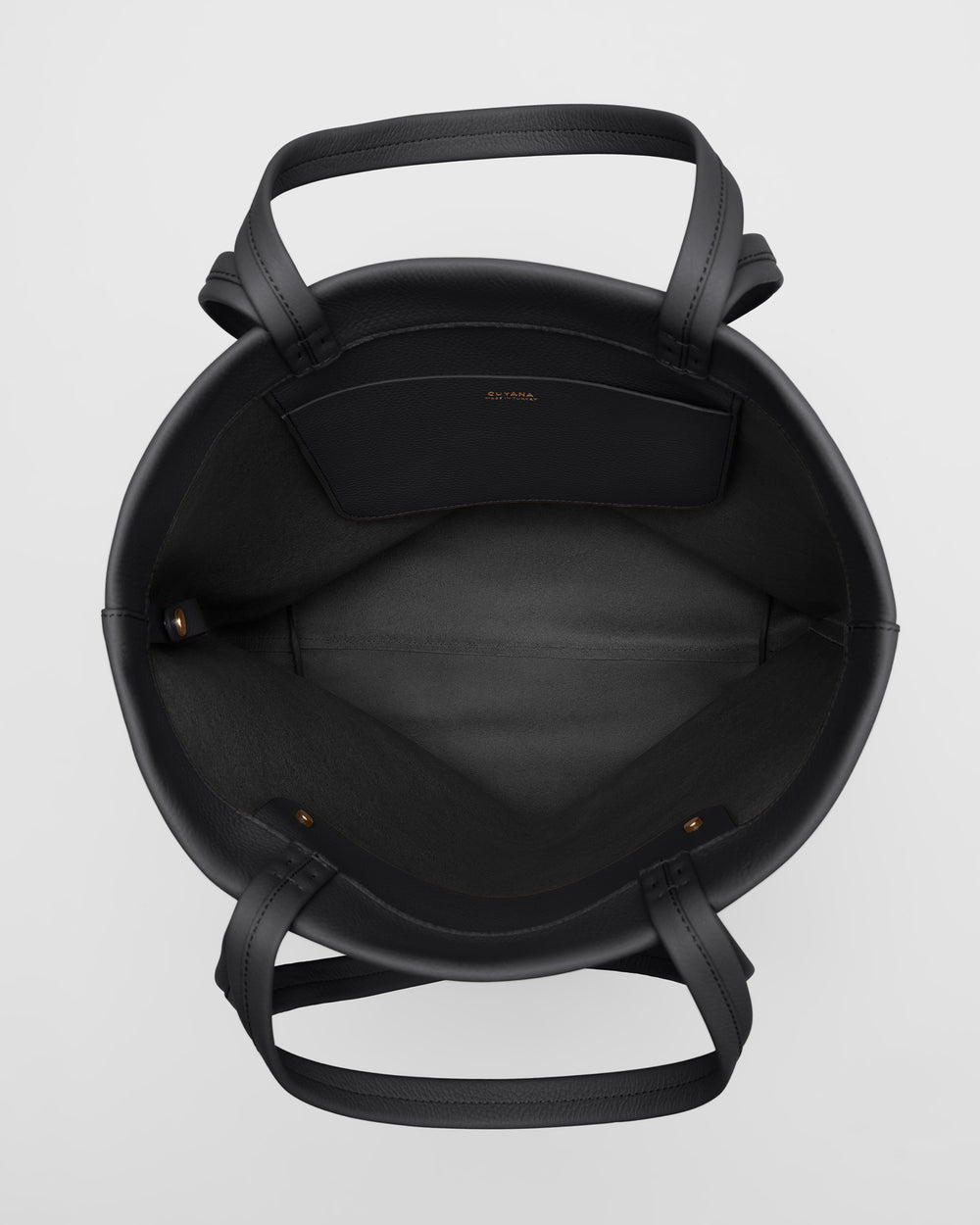 Open tote bag with handles, viewed from above.