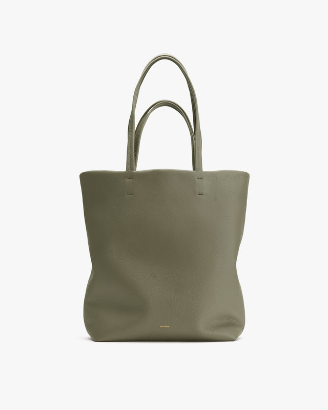 Tote bag with two handles on a plain background.