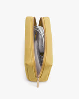 A pouch with a zipper partially open revealing electronic cables inside.