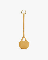 Small textured bag with a handle and a round metal ring.