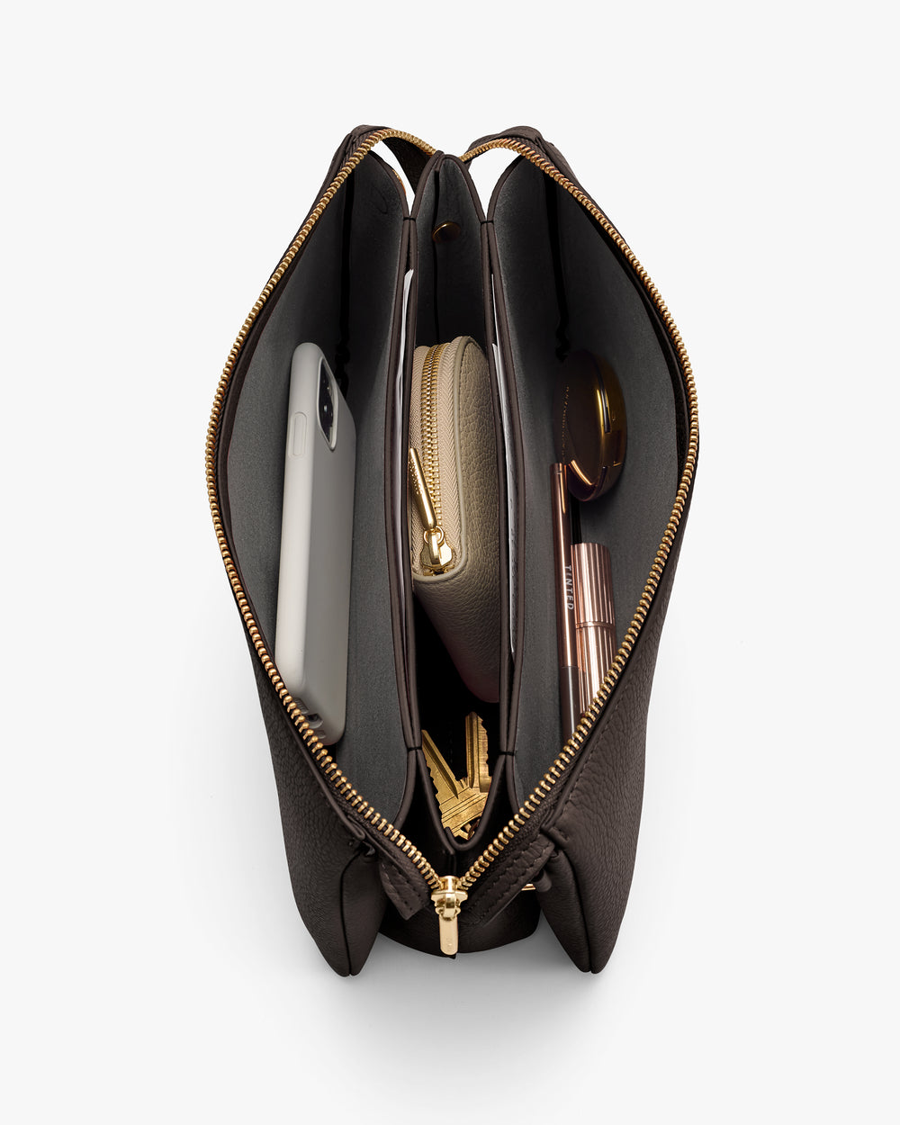 Open handbag with phone, wallet, sunglasses, keys inside.