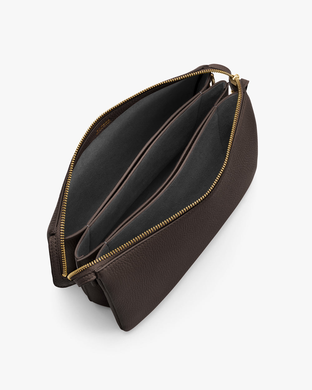 Open travel bag with multiple compartments and zippers, viewed from above.