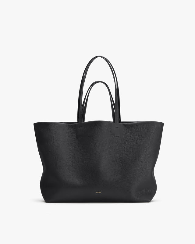 Large tote bag with double handles on a plain background.