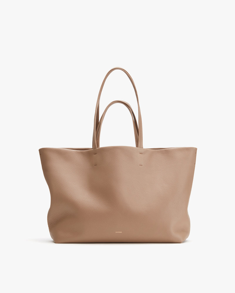 Tote bag with long handles displayed on a plain background.