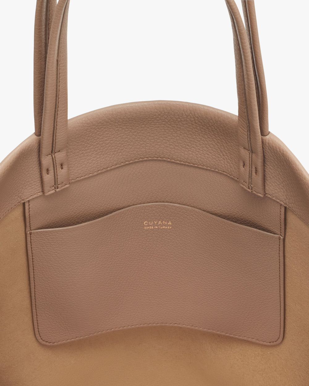 Leather handbag with double handles and a front pocket.