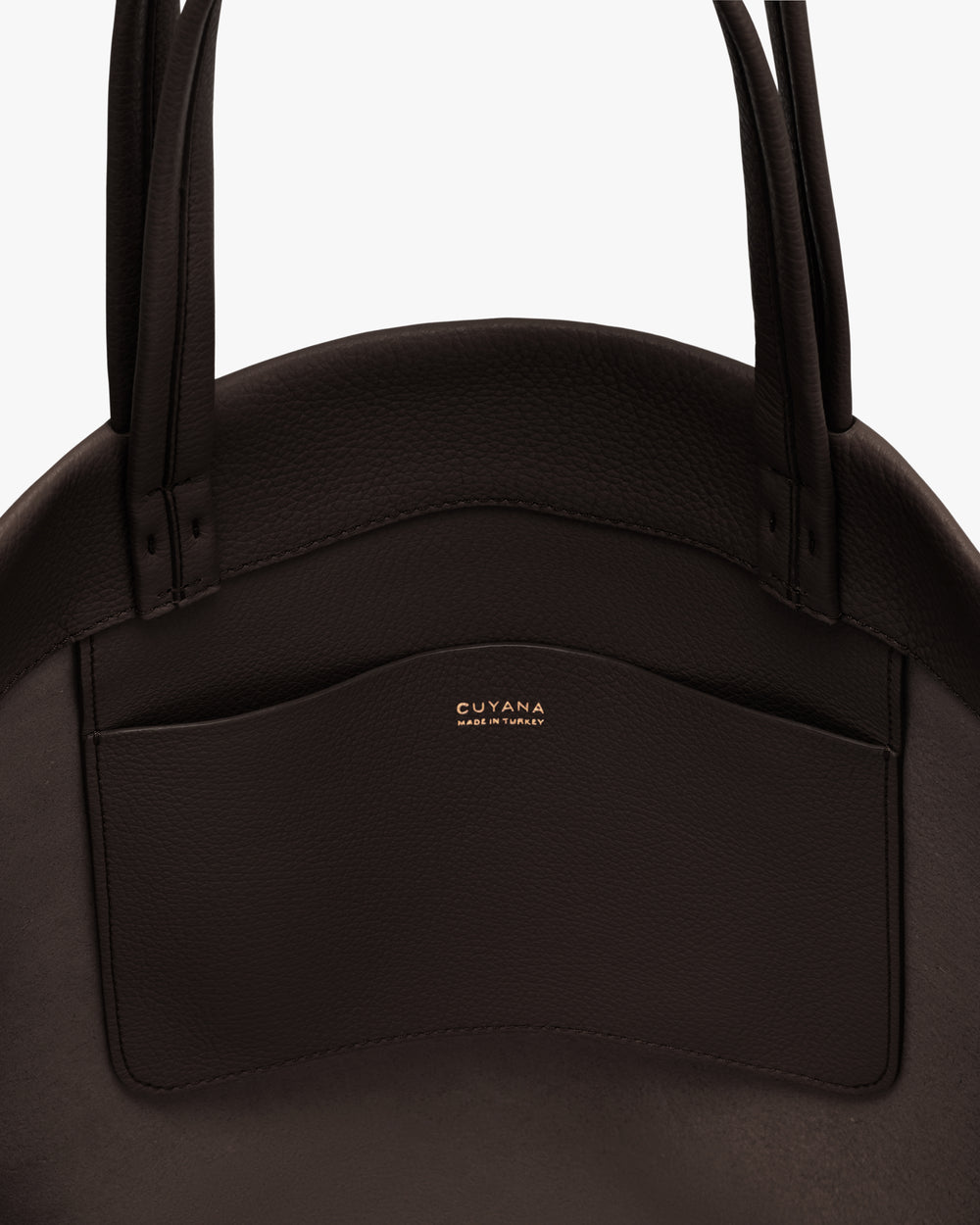 Close-up of a tote bag with visible pocket and handles.