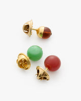 Four colorful bead charms.