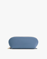 Rounded pouch with zipper on white background.