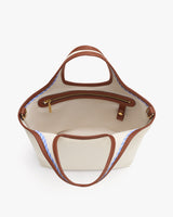 Open tote bag with handles and inner zip pocket.