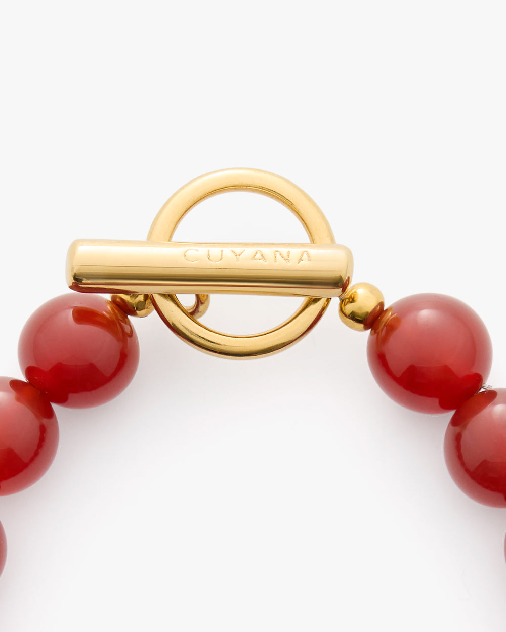 Beaded bracelet with a circular toggle clasp.