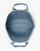 Open tote bag with handles and inner pocket.