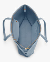 Open tote bag with zipper and interior pocket.