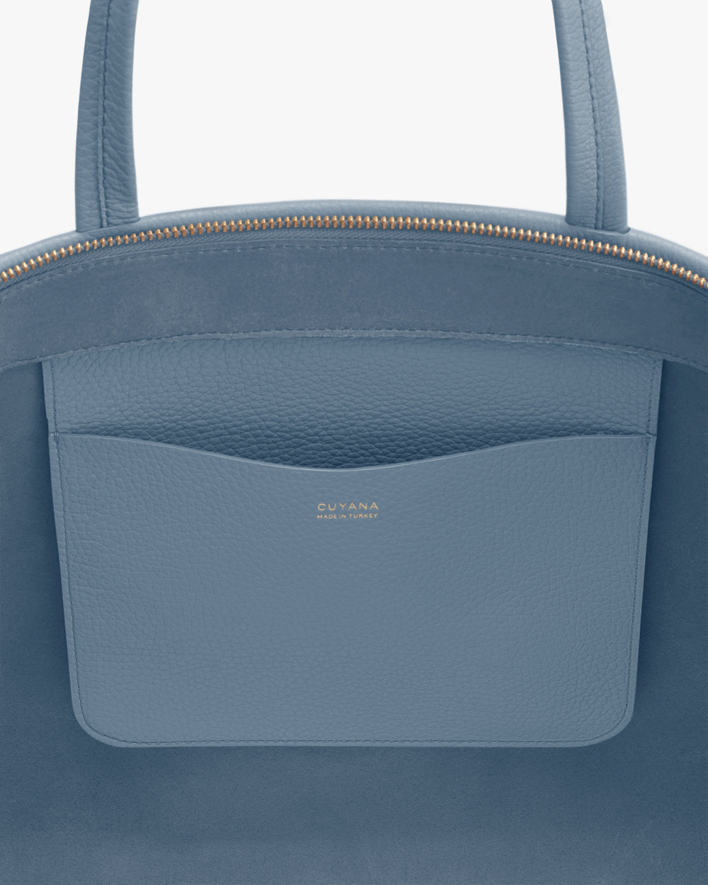 Close-up of a bag's pocket with brand logo visible.