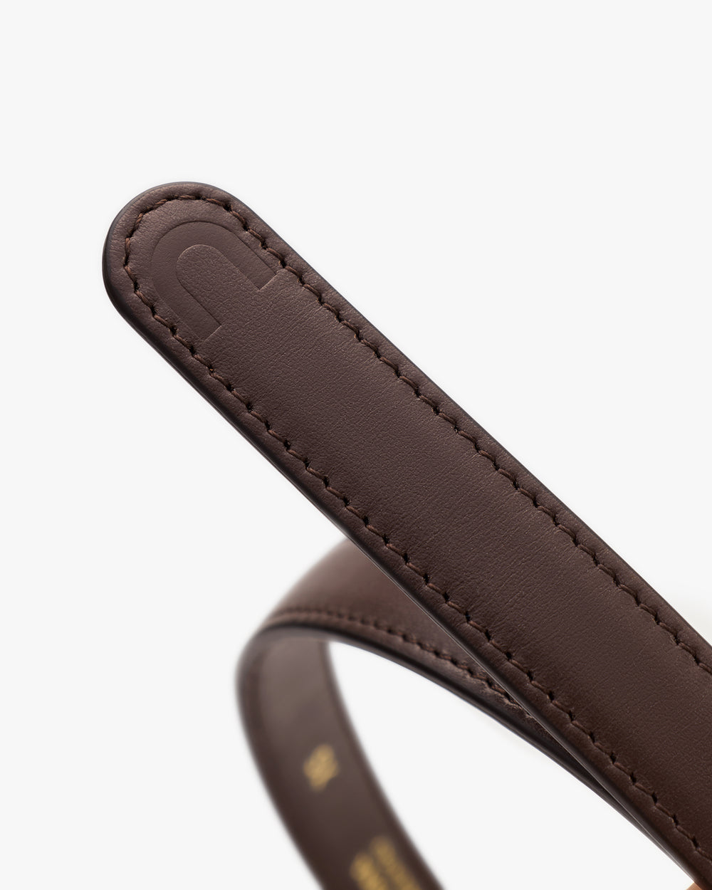 Close-up of a leather belt with stitching detail.