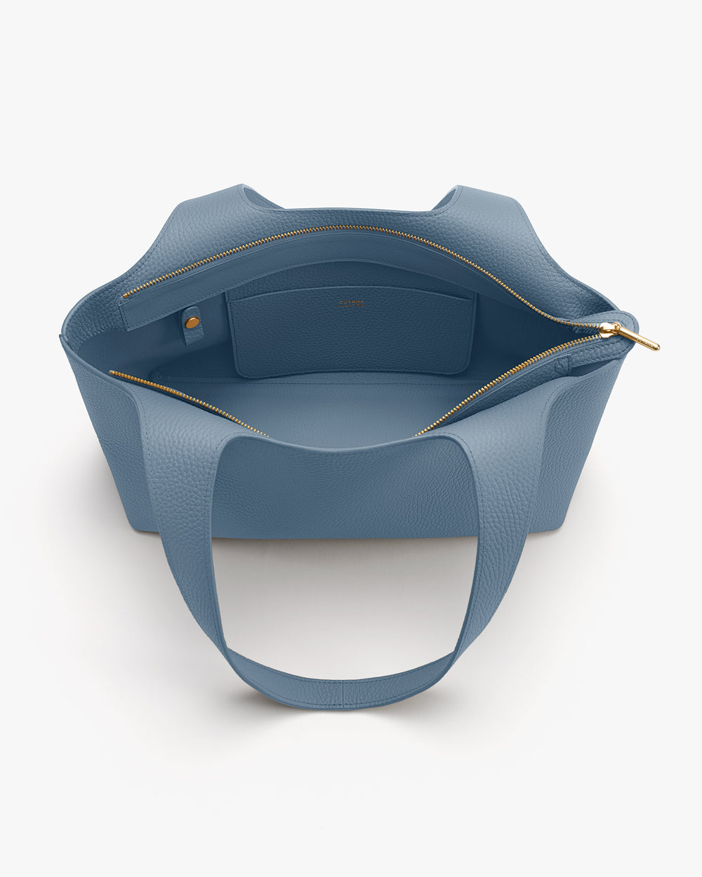 Open handbag with interior pocket and zipper.