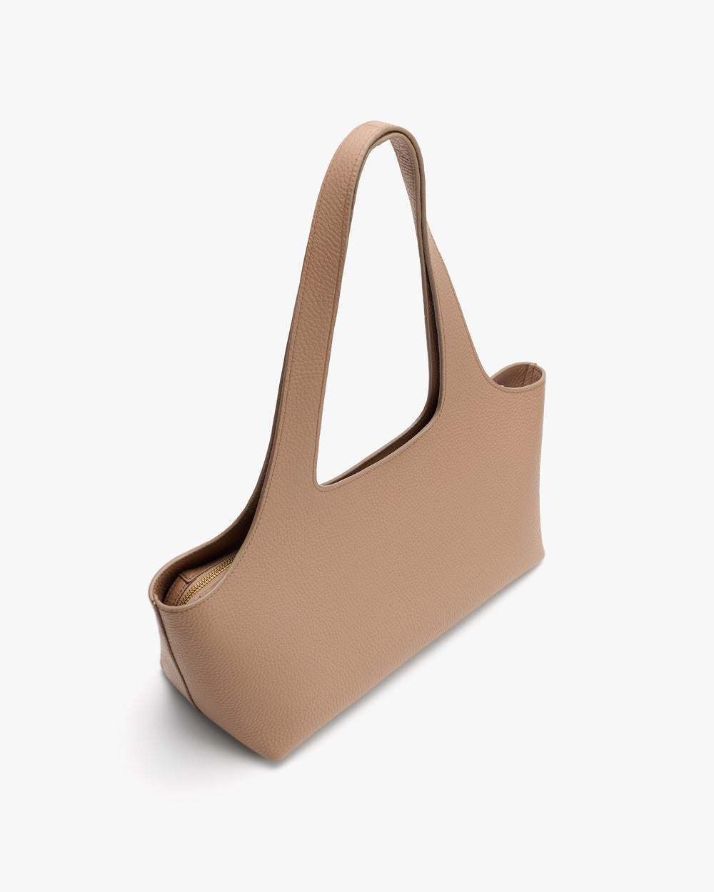 A sleek, minimalist handbag with a long shoulder strap.