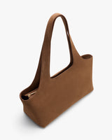 Elegant handbag with long handles and a rectangular base.
