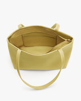 Open tote bag with a zipper pocket and open compartments inside.