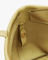 Open shoulder bag showing interior zipper and pocket details
