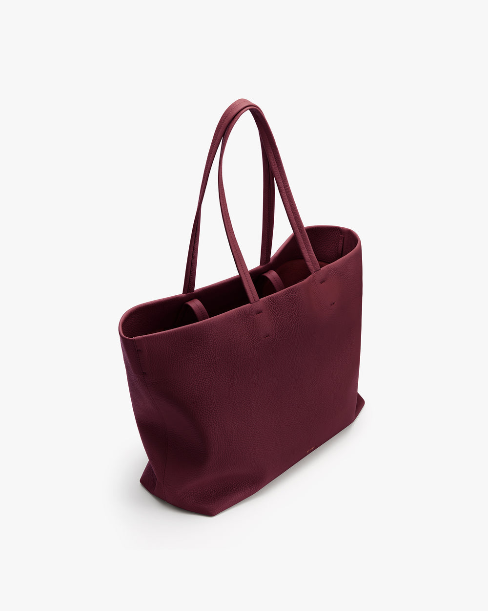 Tote bag with long handles on a plain background.