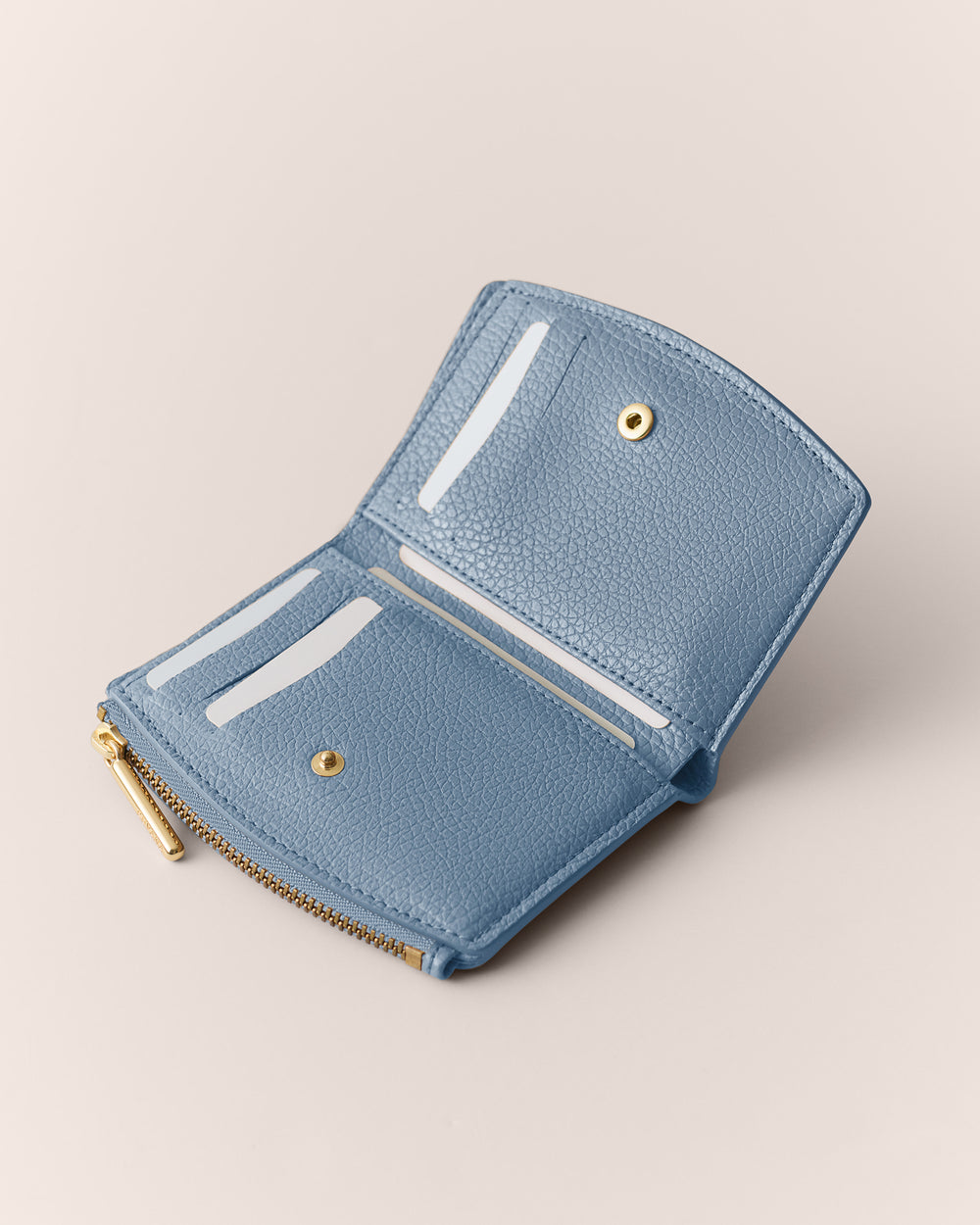 Open wallet with card slots and zippered coin pocket.