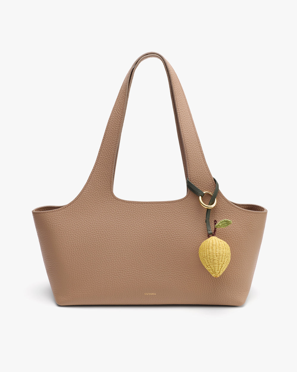 Tote bag with lemon-shaped charm attached to handle.