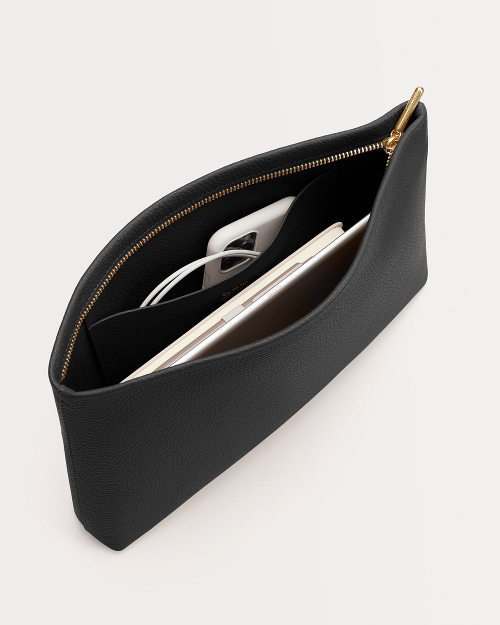 Open pouch with a phone, tablet, and earphones inside.