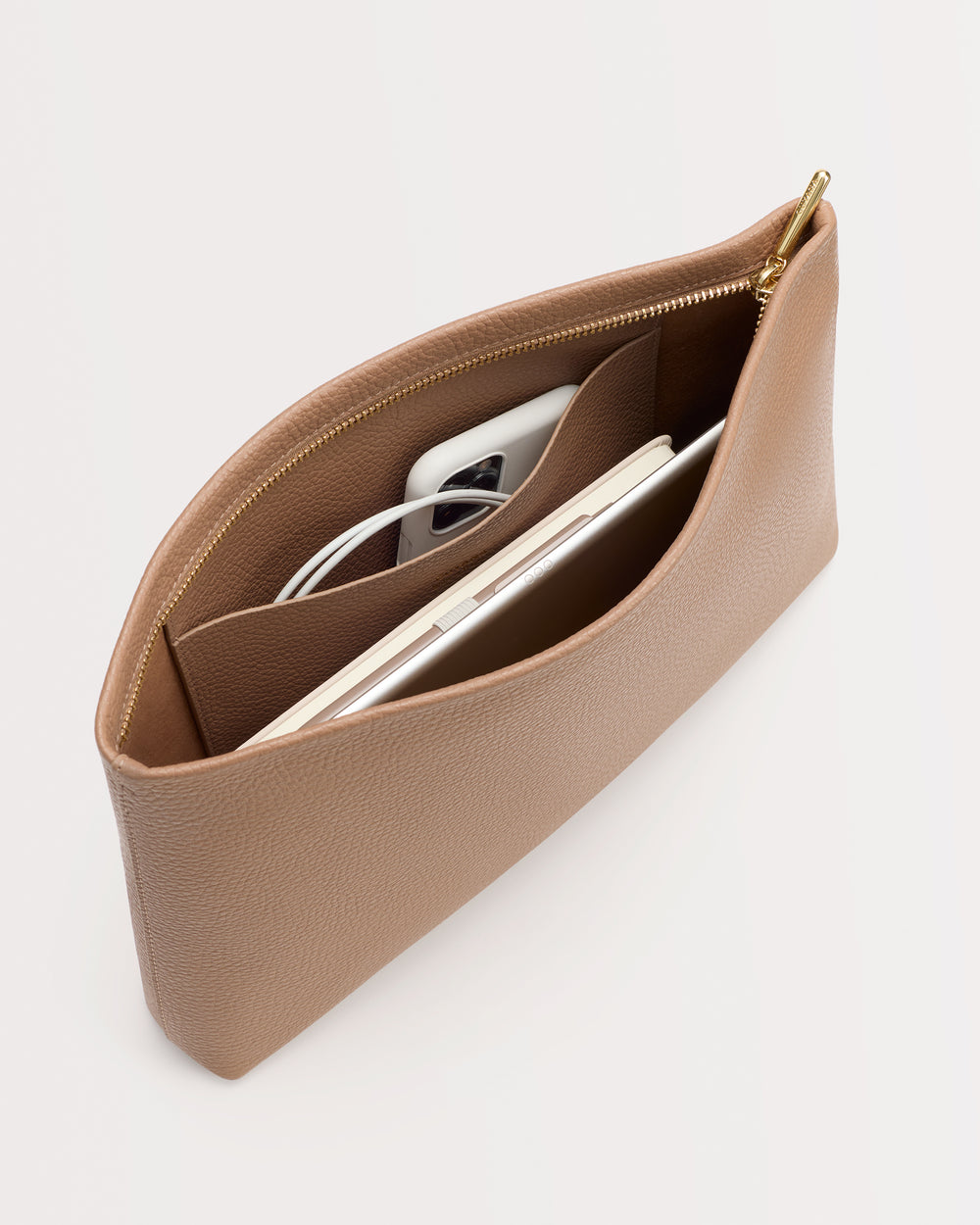 Open pouch with phone and notebook inside viewed from above.