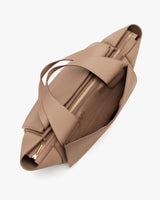 Top view of an open tote bag with wide straps and zipper.
