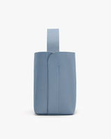 Small tote bag with a wide strap and top opening.