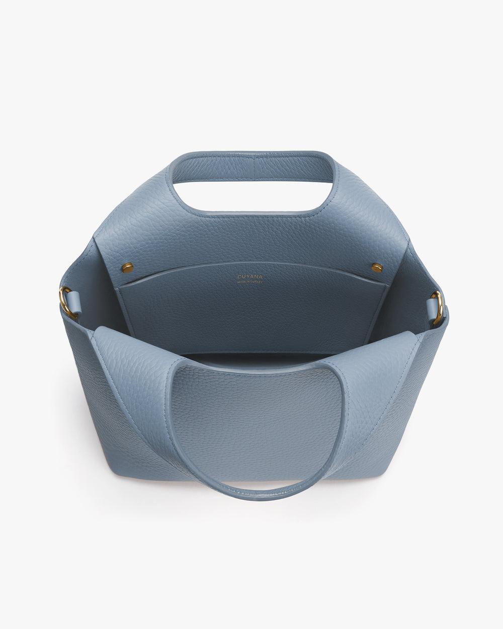 Handbag with open top and wide handles shown from above.