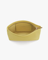Open handbag with zippered pocket and wide opening.