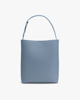 A minimalist tote bag with a single strap.