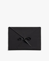 Rectangular envelope tied with a bow in the center.