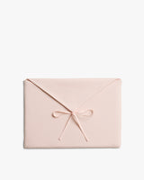 Rectangular envelope with bow on flap.