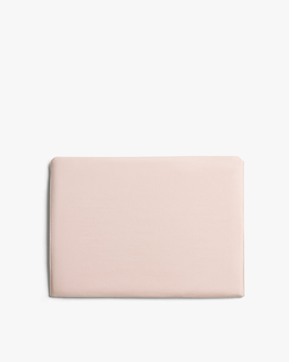 Rectangular folded fabric sheet against plain background.